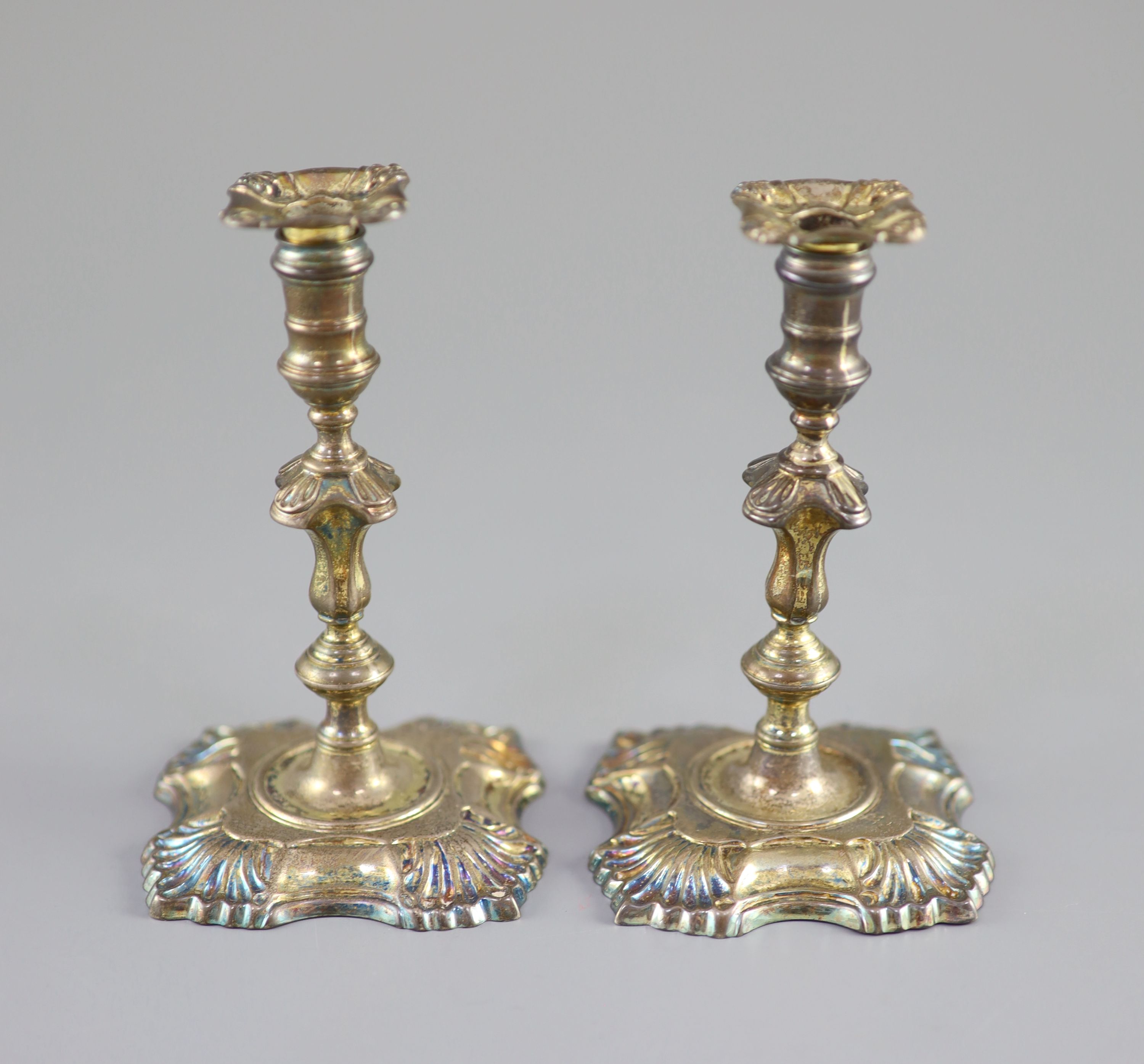 A pair of George II cast silver tapersticks, by Richard Gurney & Co